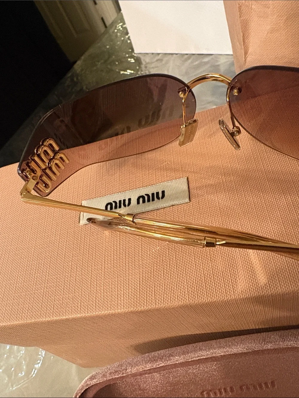 Miu Miu Rimless Sunglasses with Brown Gradient Lenses and Gold Temples